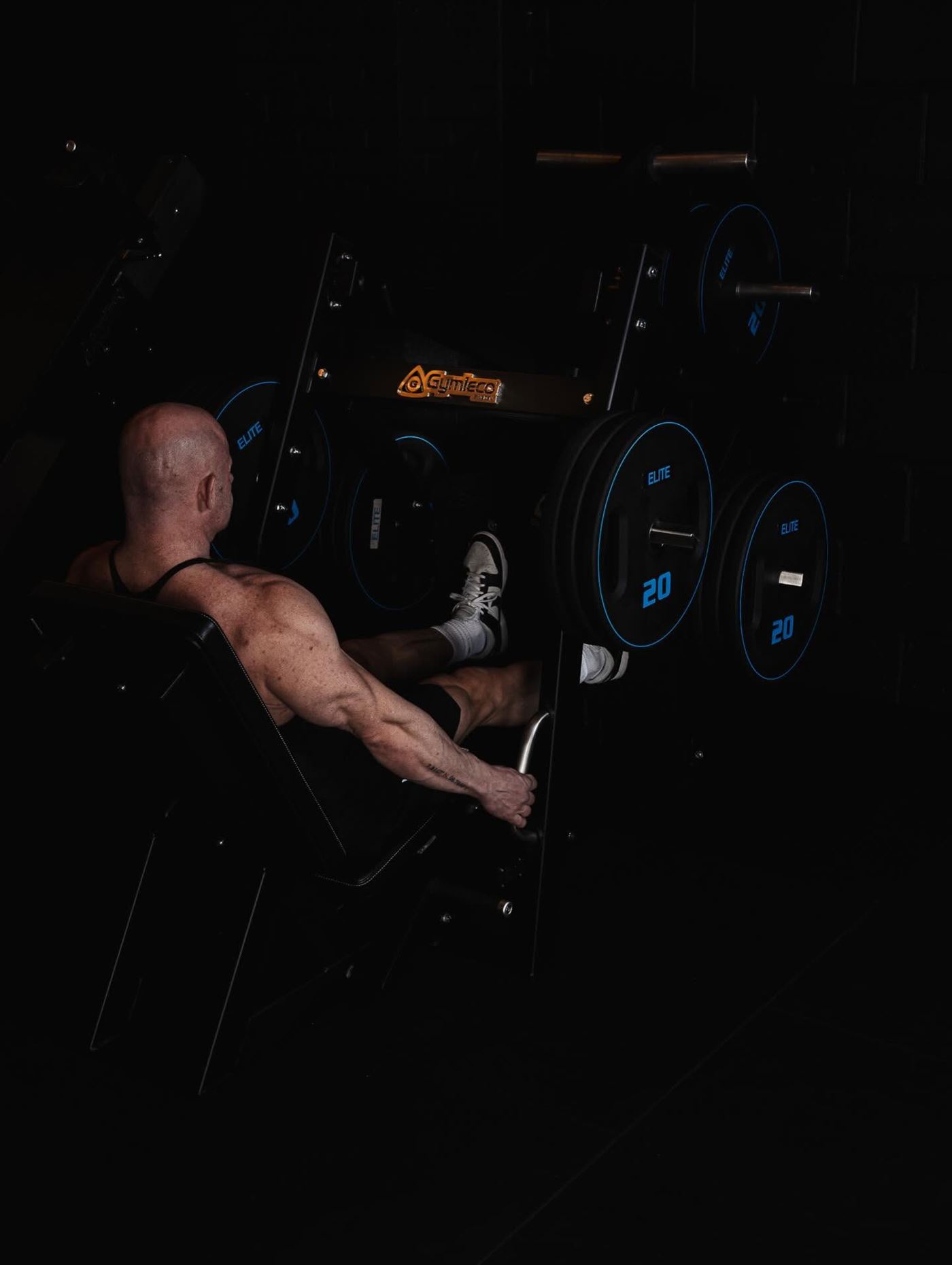 Focused strength training session at Elite Physiques