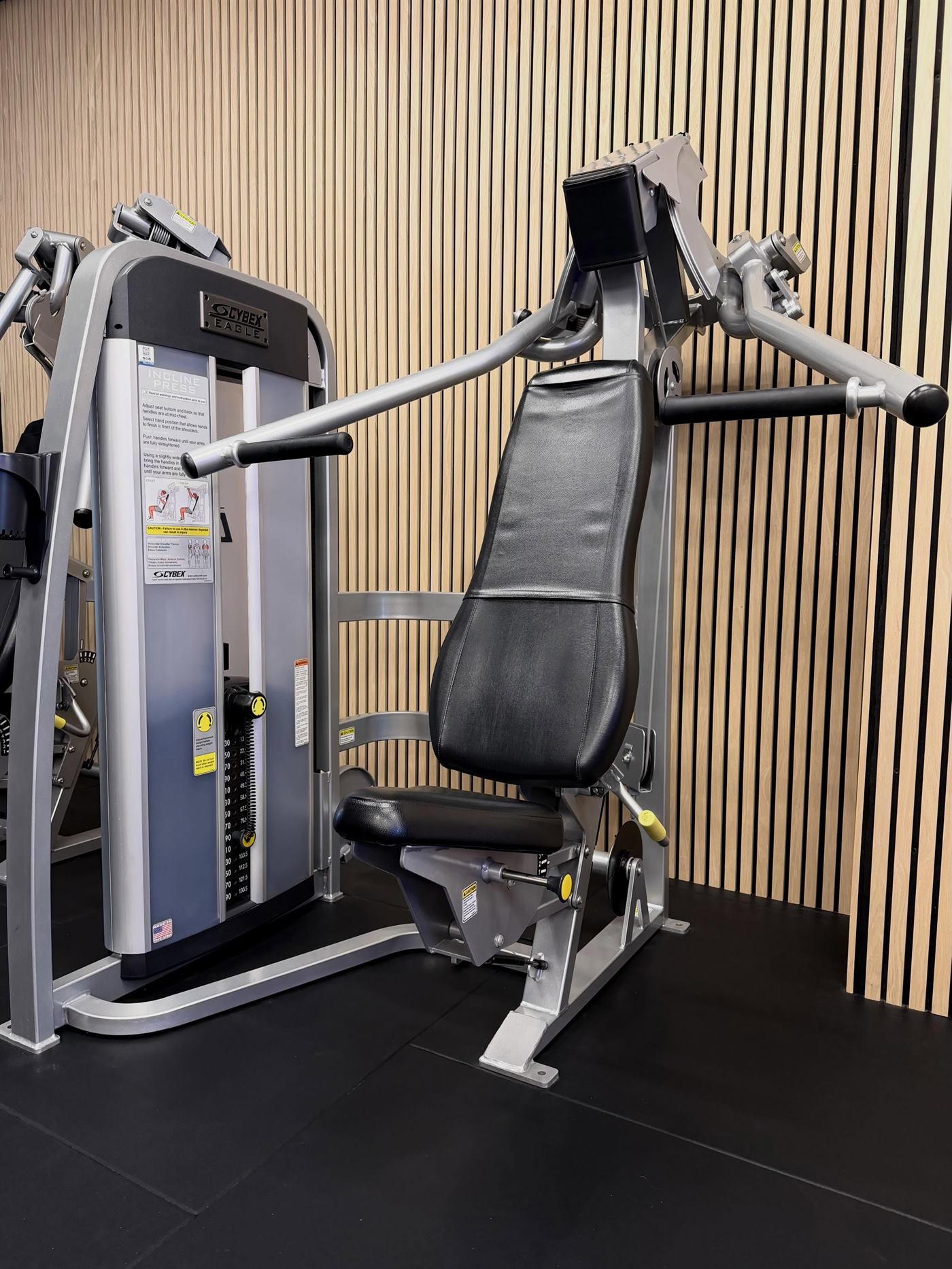 Premium Cybex Eagle strength equipment inside Elite Physiques, uncrowded training floor